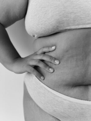 Close-up black and white photo celebrating body positivity and diversity.