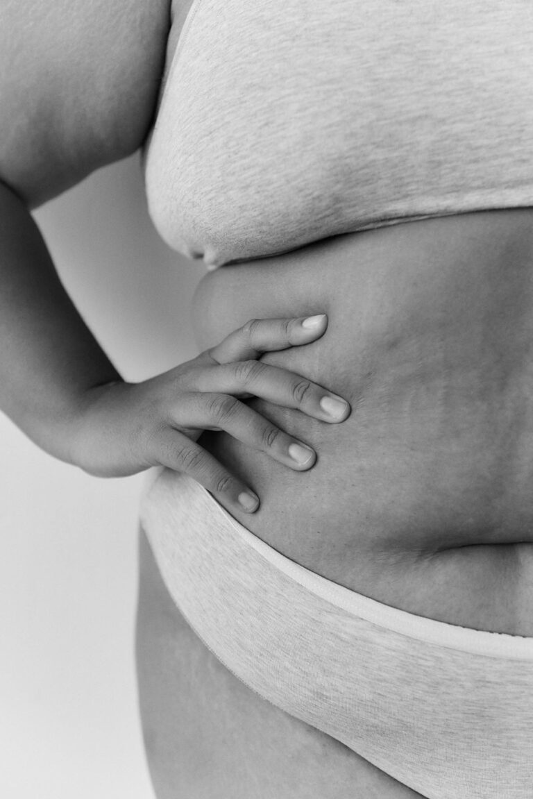 Close-up black and white photo celebrating body positivity and diversity.